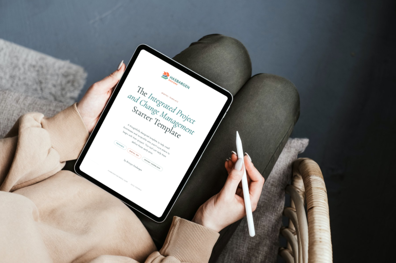 Person holding a tablet displaying the Integrated Project and Change Management Starter Template by Hasbargen Consulting.